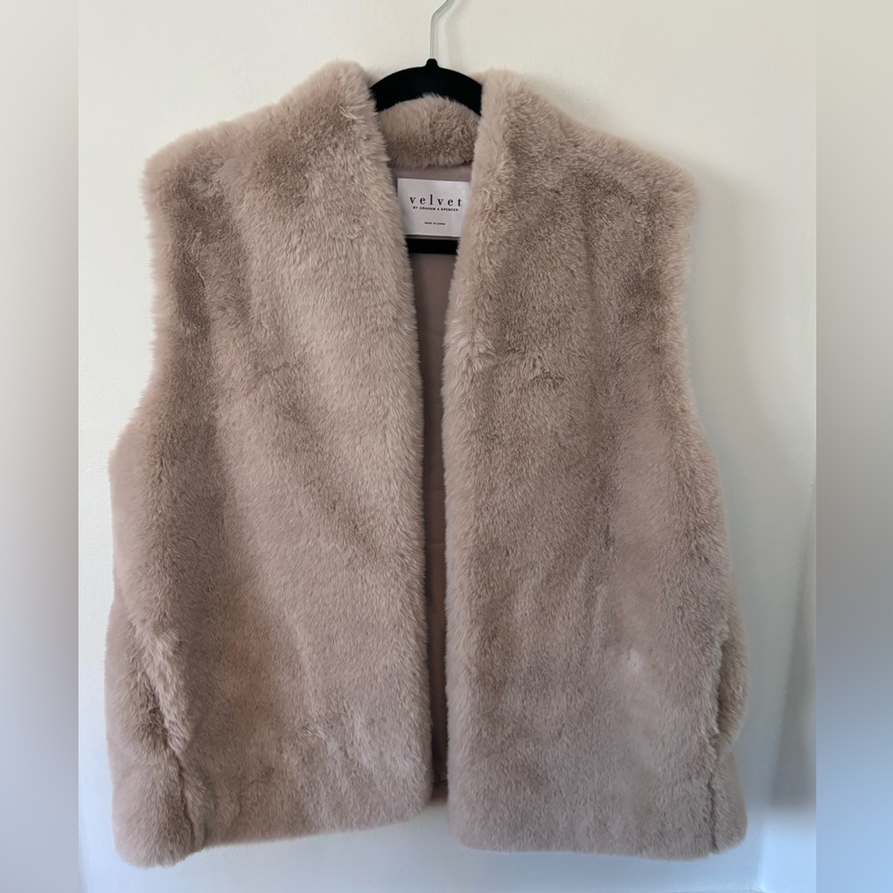 Fabulous faux fur vest with pockets!  The perfect fall/winter layer!